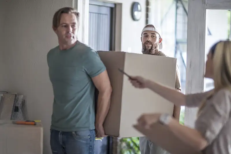 moving house two men carrying cardboard box 2024 06 17 19 01 13 utc copy